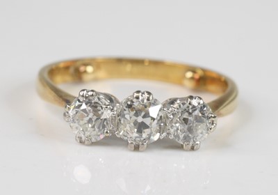 Lot 2216 - A yellow and white metal diamond three-stone...
