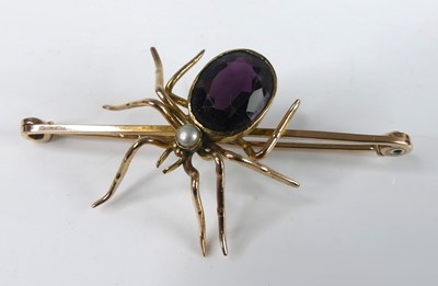 Lot 2162 - A yellow metal, amethyst and pearl spider bar...
