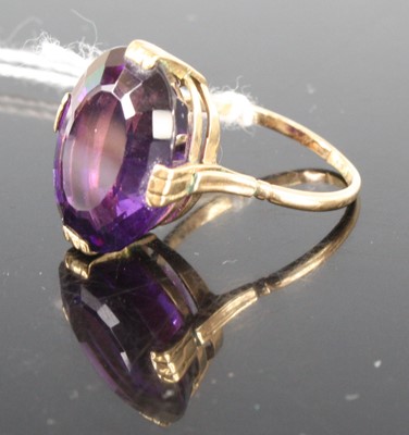 Lot 409 - A yellow metal amethyst single stone ring, the...