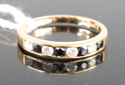 Lot 398 - A 9ct yellow gold, sapphire and diamond...