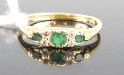 Lot 399 - An 18ct yellow gold, emerald and diamond...