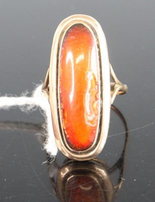 Lot 411 - A yellow metal dress ring, having a 22 x 9mm...
