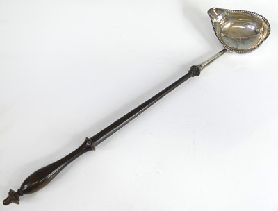Lot 2070 - A George III silver toddy ladle, having...