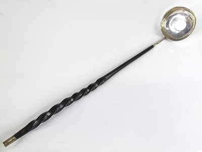 Lot 2069 - A George III white metal toddy ladle, having a...