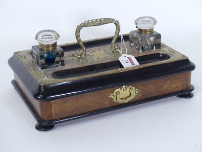 Lot 24 - A Victorian walnut parcel ebonised and brass...