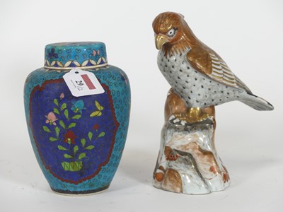 Lot 29 - A Japanese Kutani porcelain figure of an eagle,...