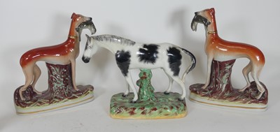 Lot 41 - A collection of four Staffordshire pottery...