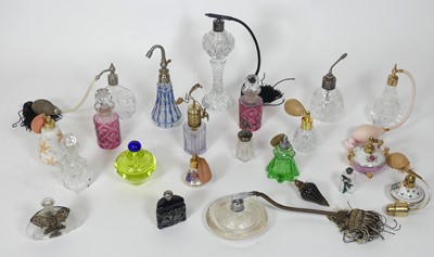 Lot 56 - A collection of glass scent bottles and...