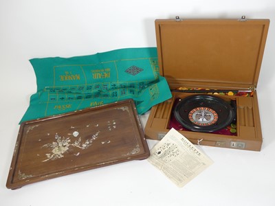 Lot 72 - A mid 20th century roulette wheel, housed in...