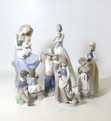 Lot 102 - A group of seven Nao porcelain figures, to...