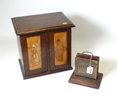 Lot 89 - An early 20th century oak smoker's cabinet,...