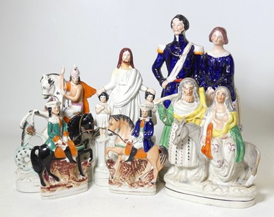 Lot 133 - A collection of Staffordshire pottery figures,...