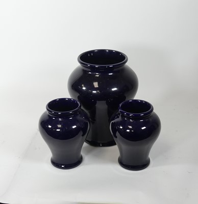 Lot 151 - A pair of Royal Doulton dark blue glazed...