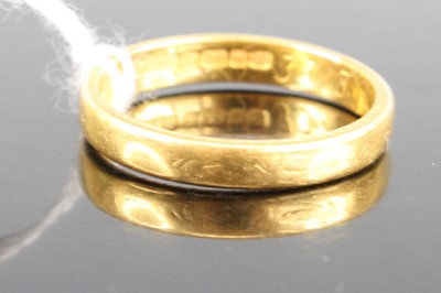 Lot 401 - A 22ct gold court shaped wedding band, sponsor...