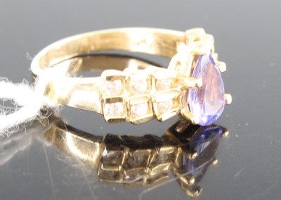 Lot 410 - A modern 14ct gold tanzanite and diamond dress...