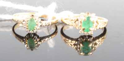 Lot 413 - A modern 9ct gold emerald and diamond cluster...
