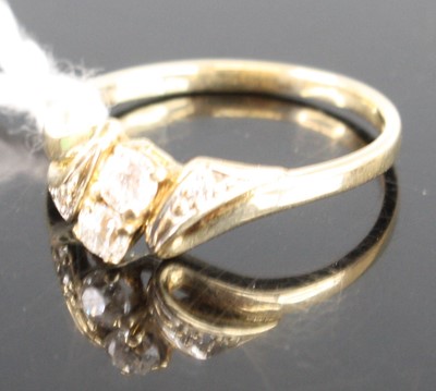 Lot 414 - A 9ct gold diamond dress ring, arranged as two...