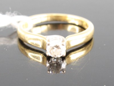 Lot 417 - An 18ct gold diamond solitaire ring, the four...