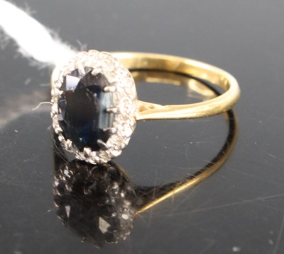 Lot 418 - An 18ct gold blue & white sapphire cluster...