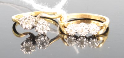 Lot 421 - An 18ct gold diamond crossover ring, arranged...