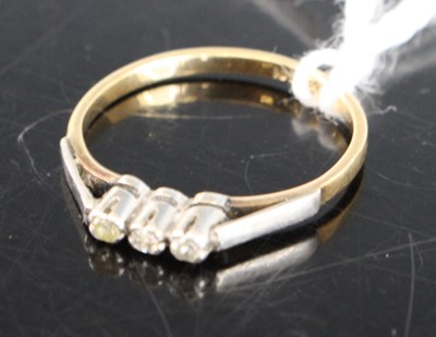 Lot 422 - An 18ct gold and platinum diamond three stone...
