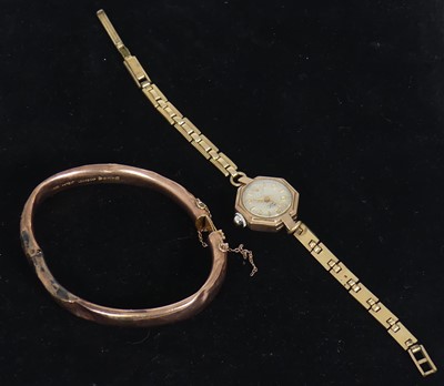 Lot 444 - A 9ct gold hollow hinged bangle, with safety...