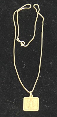 Lot 450 - A 9ct gold Zodiac pendant, on finelink neck...