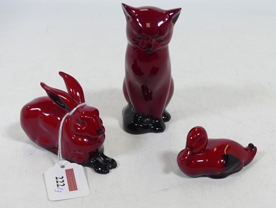 Lot 222 - A Royal Doulton flambe figure of a seated cat,...