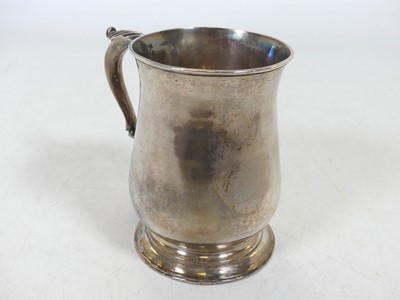 Lot 234 - A George II silver tankard, of bell shape,...