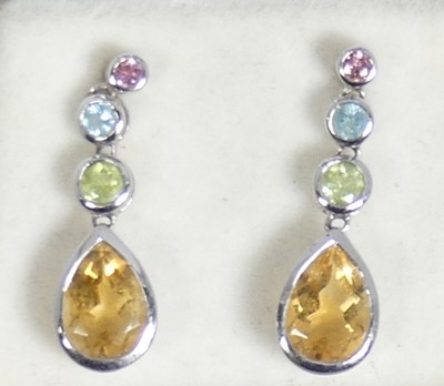 Lot 472 - A pair of modern white metal multi-stone topaz...