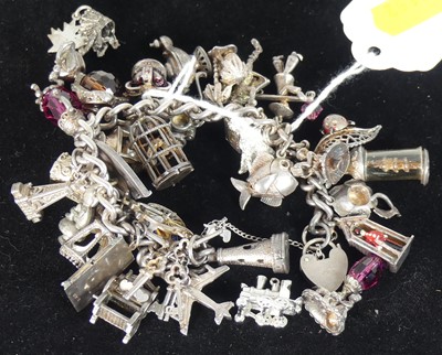 Lot 486 - A white metal bracelet containing a large...