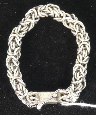 Lot 487 - A modern silver Byzantine link bracelet with...