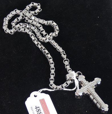 Lot 320A - A black and blue steel cross pendant set with...