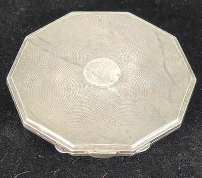 Lot 495 - An engine turned silver lady's powder compact,...