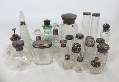 Lot 246 - A collection of silver topped glass dressing...