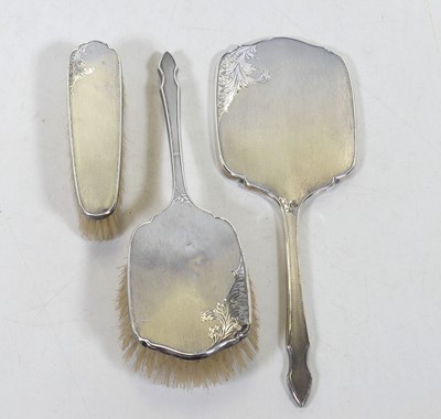 Lot 249 - An Elizabeth II silver-clad dressing table set,...