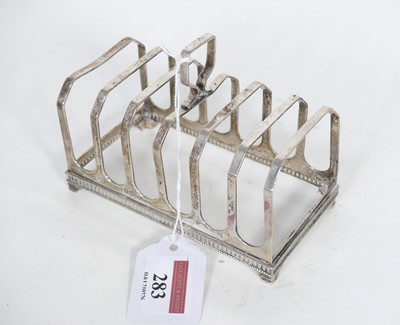 Lot 283 - A George V silver toast rack, having six...