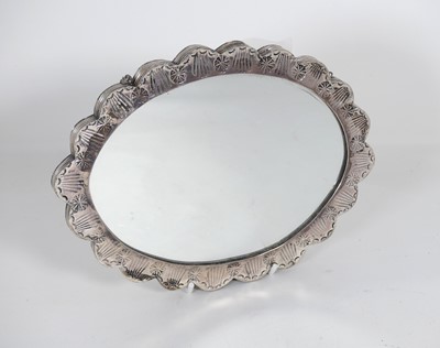 Lot 311 - A 20th century mirror, the oval plate within a...