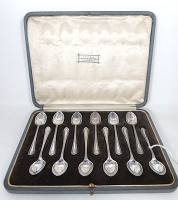 Lot 324 - A set of 12 George VI silver coffee spoons in...
