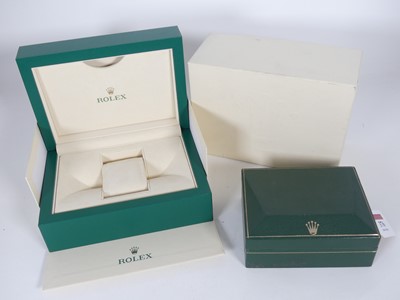 Lot 376 - A green leather watchbox with Rolex crown in...