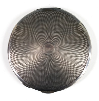 Lot 110 - An Art Deco silver lady's compact, of circular...