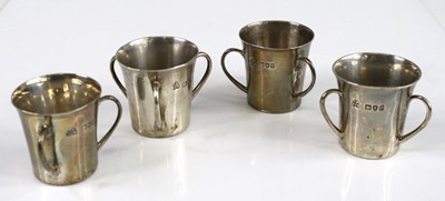 Lot 99 - A set of four circa 1900 silver tyg spirit...
