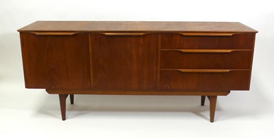Lot 437 - A 1960s teak compact sideboard, having central...
