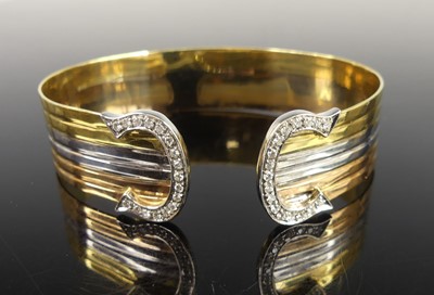 Lot 2175 - A rose, white and yellow metal banded torque...