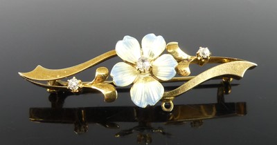 Lot 2159 - A yellow metal diamond bar brooch, featuring a...