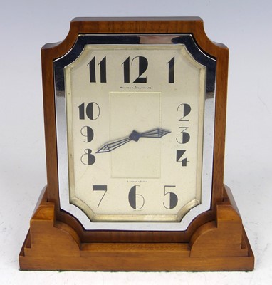 Lot 215 - An Art Deco walnut mantel clock by Waring &...