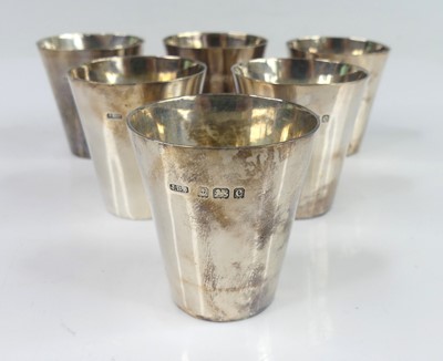 Lot 100 - A set of six circa 1900 silver spirit measures,...