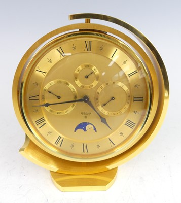 Lot 217 - Looping of Switzerland - a brushed brass desk...