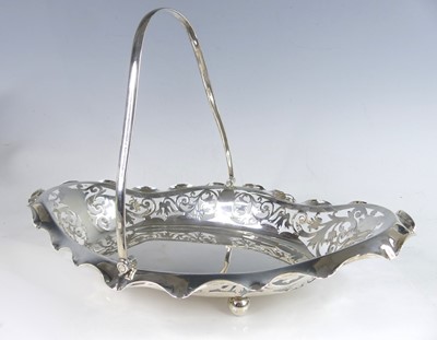 Lot 2132 - A George V silver swing handled table basket,...