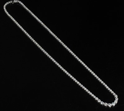 Lot 2237 - A white metal diamond riviere, comprising 145...